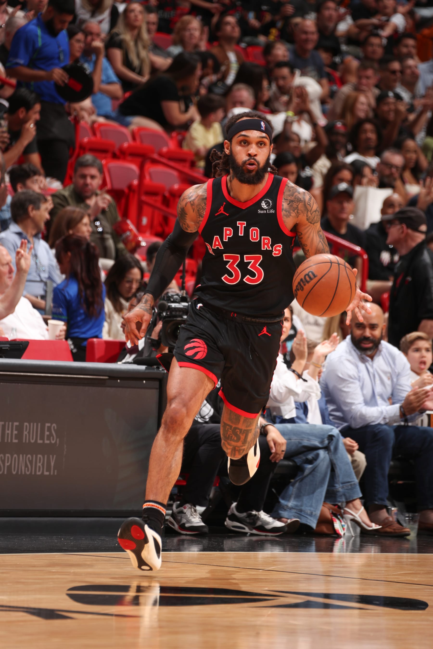 MIAMI, FL - APRIL 14:  Gary Trent Jr. #33 of the Toronto Raptors handles the ball during the game  on April 14, 2024 at Kaseya Center in Miami, Florida. NOTE TO USER: User expressly acknowledges and agrees that, by downloading and or using this Photograph, user is consenting to the terms and conditions of the Getty Images License Agreement. Mandatory Copyright Notice: Copyright 2024 NBAE (Photo by Issac Baldizon/NBAE via Getty Images)