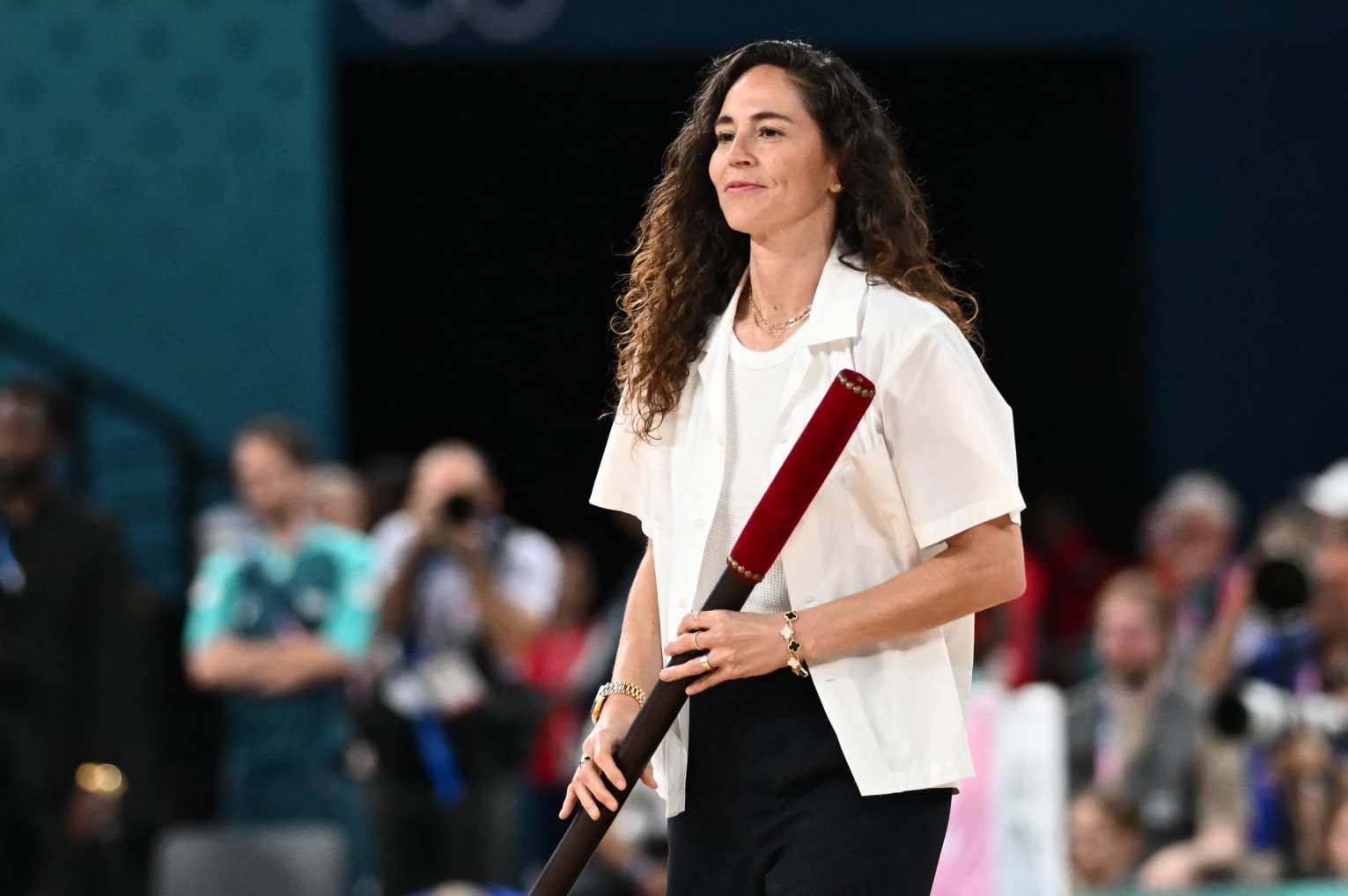 US basketball player Sue Bird opens the session in the women's Gold Medal basketball match between France and the USA during the Paris 2024 Olympic Games at the Bercy  Arena in Paris on August 11, 2024. (Photo by Aris MESSINIS / AFP) (Photo by ARIS MESSINIS/AFP via Getty Images)