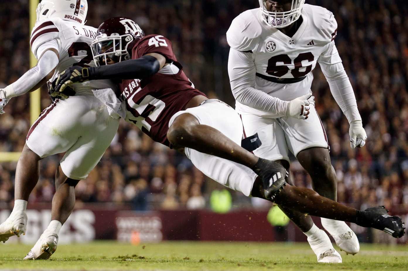 COLLEGE STATION, TEXAS - NOVEMBER 11: Edgerrin Cooper #45 of the Texas A&M Aggies tackles Seth Davis #23 of the Mississippi State Bulldogs near the goal line in the first quarter at Kyle Field on November 11, 2023 in College Station, Texas. (Photo by Tim Warner/Getty Images)