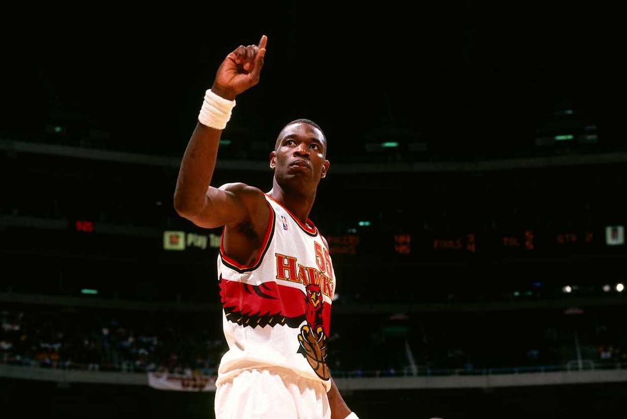ATLANTA, GA - APRIL 9: Dikembe Mutombo #55 of the Atlanta Hawks waves his finger after a block shot against the Indiana Pacers at the Georgia Dome on April 9, 1998 in Atlanta, Georgia. NOTE TO USER: User expressly acknowledges and agrees that, by downloading and/or using this photograph, user is consenting to the terms and conditions of the Getty Images License Agreement. Mandatory Copyright Notice: Copyright 1998 NBAE (Photo by Scott Cunningham/NBAE via Getty Images)