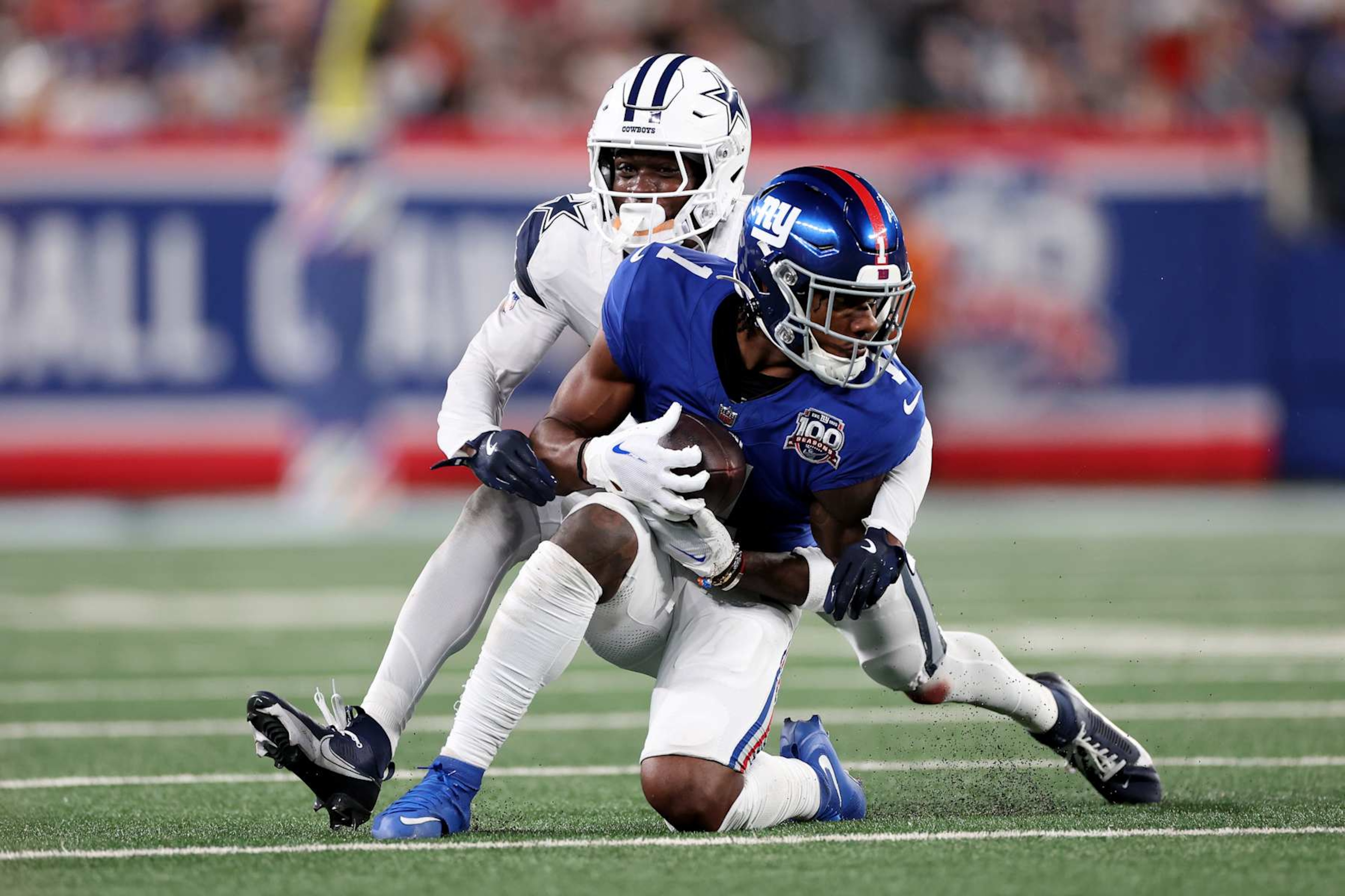 EAST RUTHERFORD, NEW JERSEY - SEPTEMBER 26: Andrew Booth Jr. #25 of the Dallas Cowboys tackles Malik Nabers #1 of the New York Giants during the second quarter at MetLife Stadium on September 26, 2024 in East Rutherford, New Jersey. (Photo by Luke Hales/Getty Images) EAST RUTHERFORD, NEW JERSEY - SEPTEMBER 26: Andrew Booth Jr. #25 of the Dallas Cowboys tackles Malik Nabers #1 of the New York Giants during the second quarter at MetLife Stadium on September 26, 2024 in East Rutherford, New Jersey. (Photo by Luke Hales/Getty Images)