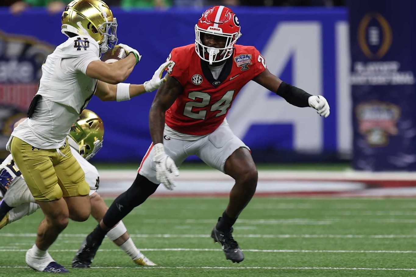NEW ORLEANS, LOUISIANA - JANUARY 2: Jordan Faison #6 of the Notre Dame Fighting Irish advances the ball against Malaki Starks #24 of the Georgia Bulldogs during the game between the Georgia Bulldogs and the Notre Dame Fighting Irish at Caesars Superdome on January 2, 2025 in New Orleans, Louisiana. (Photo by CFP/Getty Images)
