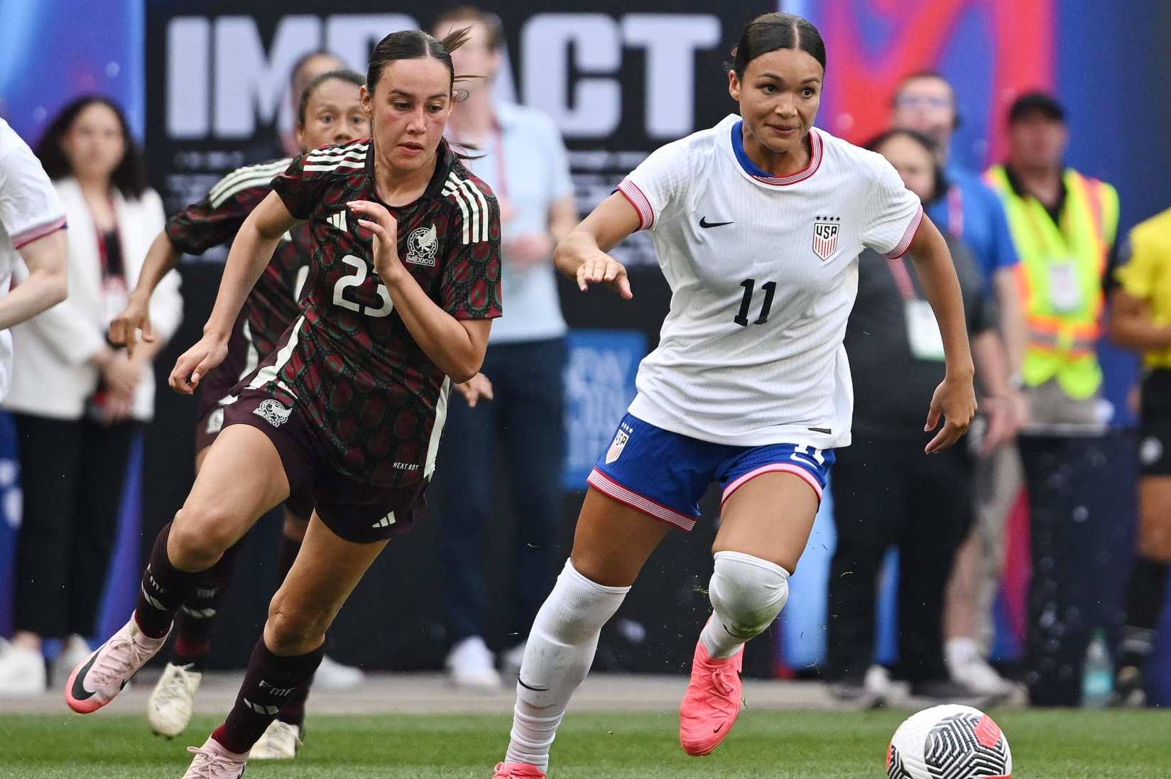 HARRISON, NEW JERSEY - JULY 13: Sophia Smith #11 of the United States is pursued by Kimberly Rodríguez #23 of Mexico during the second half at Red Bull Arena on July 13, 2024 in Harrison, New Jersey. (Photo by Howard Smith/ISI Photos/USSF/Getty Images for USSF)