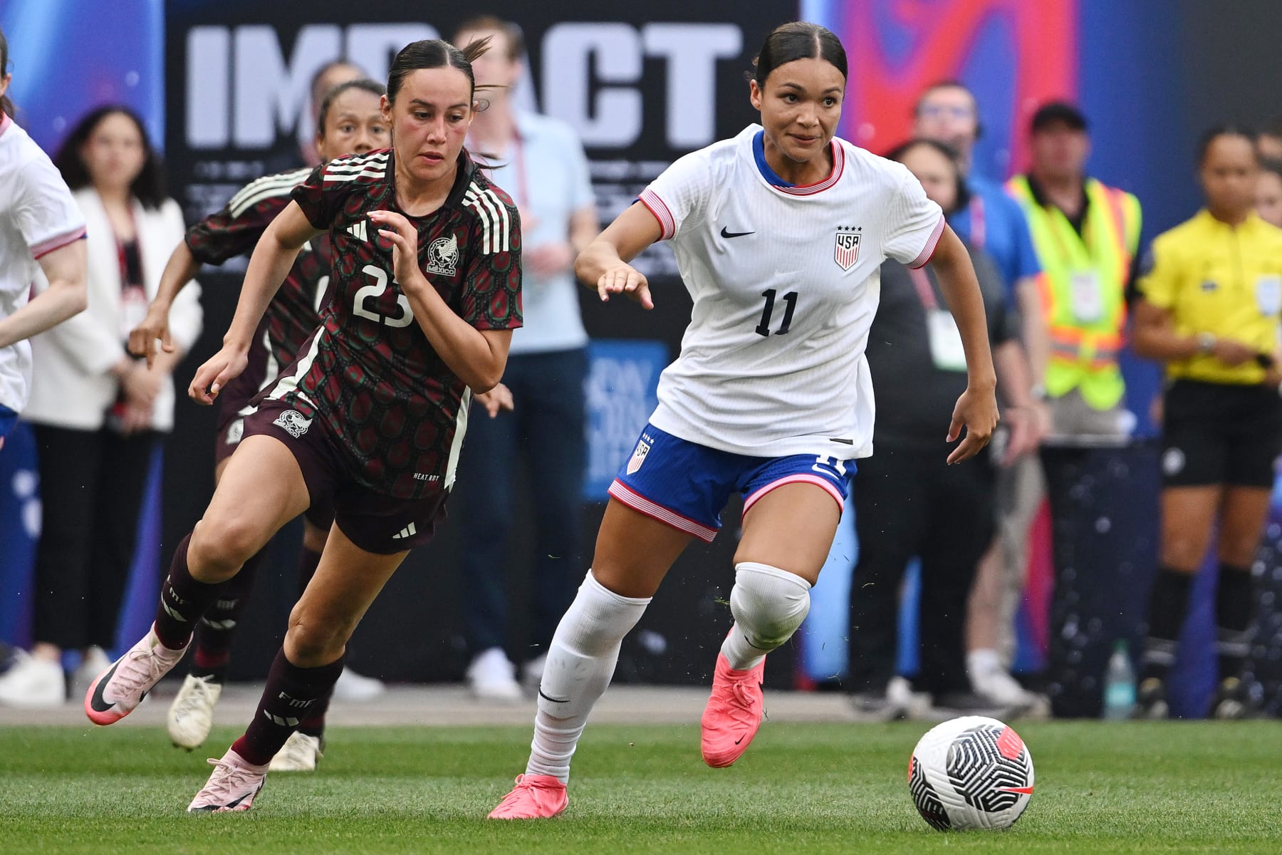 HARRISON, NEW JERSEY - JULY 13: Sophia Smith #11 of the United States is pursued by Kimberly Rodríguez #23 of Mexico during the second half at Red Bull Arena on July 13, 2024 in Harrison, New Jersey. (Photo by Howard Smith/ISI Photos/USSF/Getty Images for USSF)