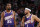 PORTLAND, OR - DECEMBER 19: Kevin Durant #35 of the Phoenix Suns and Devin Booker #1 of the Phoenix Suns look on during the game against the Portland Trail Blazers on December 19, 2023 at the Moda Center Arena in Portland, Oregon. NOTE TO USER: User expressly acknowledges and agrees that, by downloading and or using this photograph, user is consenting to the terms and conditions of the Getty Images License Agreement. Mandatory Copyright Notice: Copyright 2023 NBAE (Photo by Cameron Browne/NBAE via Getty Images)
