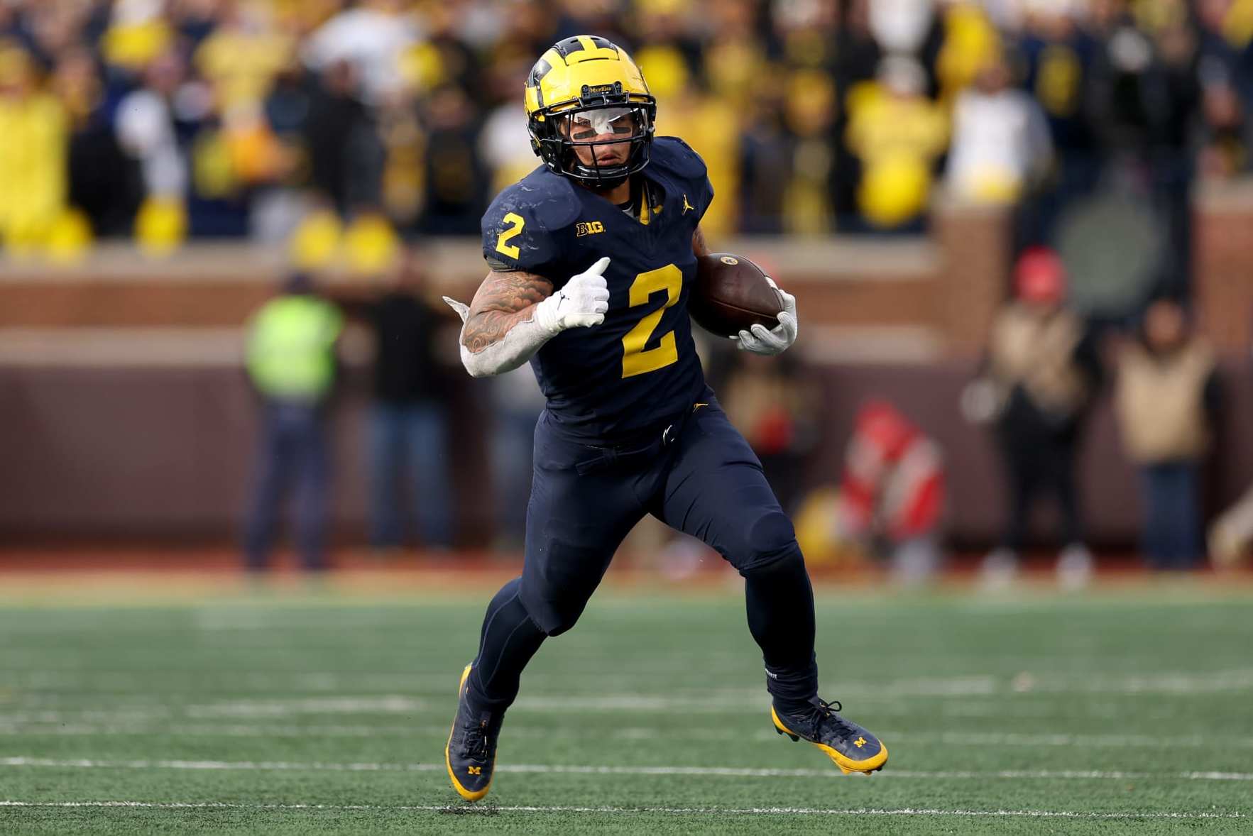 ANN ARBOR, MICHIGAN - NOVEMBER 25: Blake Corum #2 of the Michigan Wolverines runs the ball against the Ohio State Buckeyes during the second half in the game at Michigan Stadium on November 25, 2023 in Ann Arbor, Michigan. (Photo by Ezra Shaw/Getty Images)