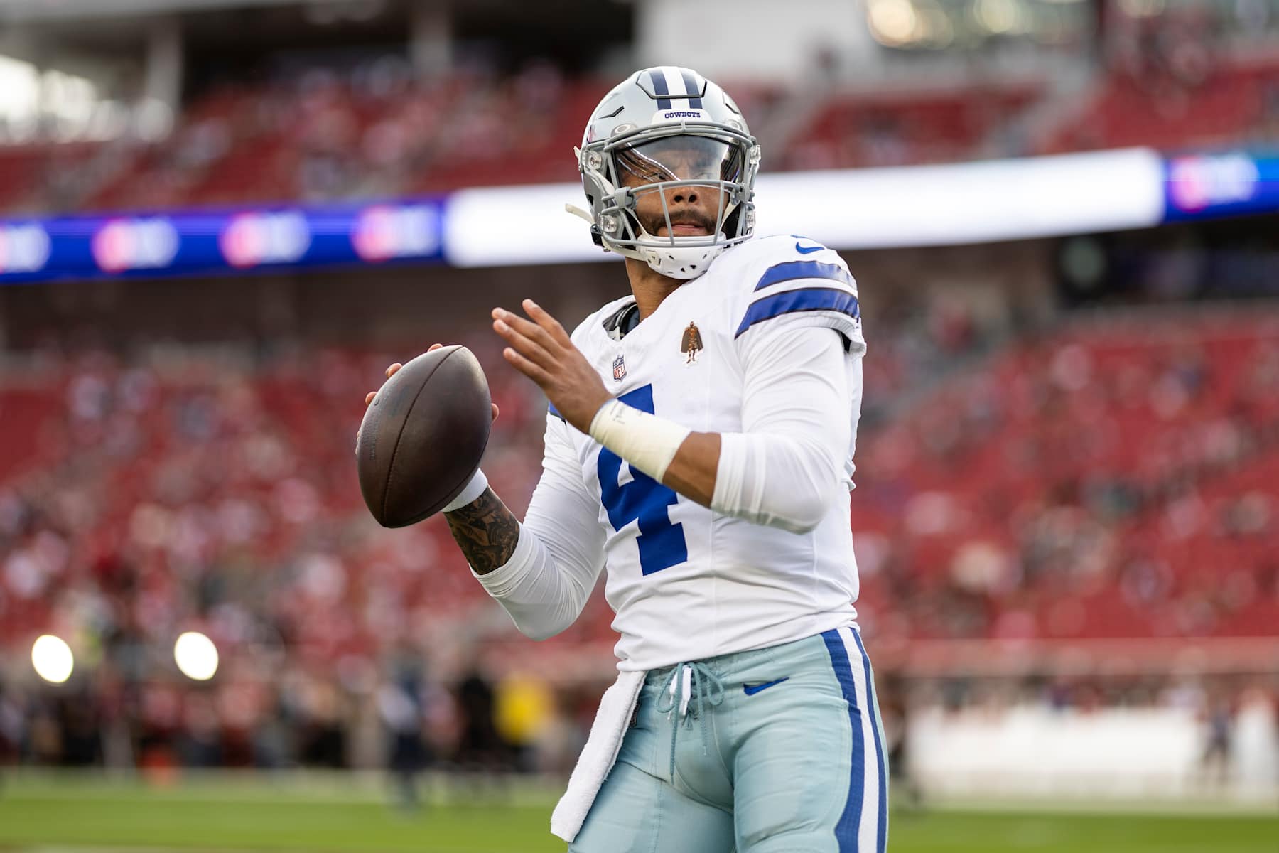 SANTA CLARA, CALIFORNIA - OCTOBER 27: Dak Prescott #4 of the Dallas Cowboys looks to pass as he warms up prior to an NFL Football game against the San Francisco 49ers at Levi's Stadium on October 27, 2024 in Santa Clara, California. (Photo by Michael Owens/Getty Images)