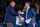 ANN ARBOR, MICHIGAN - JANUARY 13: Athletic Director Warde Manuel (L) and Head Football Coach Jim Harbaugh (R) of the Michigan Wolverines shake hands onstage during the National Championship Celebration at Crisler Center on January 13, 2024 in Ann Arbor, Michigan. (Photo by Aaron J. Thornton/Getty Images)