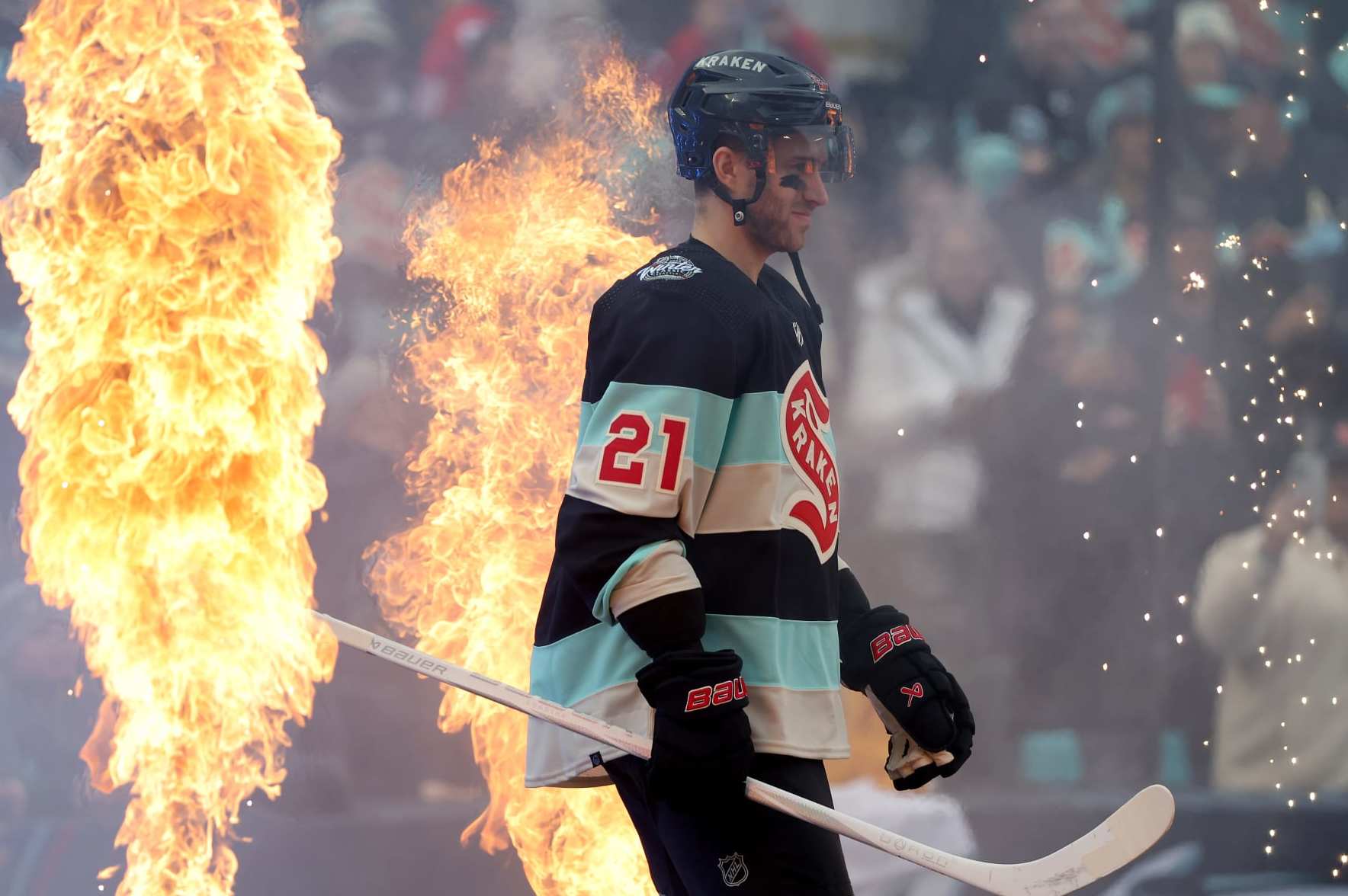 SEATTLE, WASHINGTON - JANUARY 01: Alex Wennberg #21 of the Seattle Kraken walks toward the ice prior to the game against the Vegas Golden Knights at T-Mobile Park on January 01, 2024 in Seattle, Washington. (Photo by Steph Chambers/Getty Images)