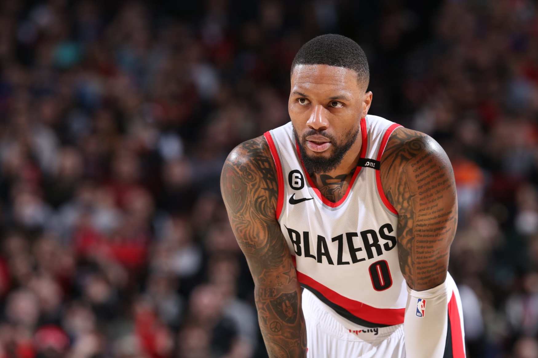 PORTLAND, OR - MARCH 14:  Damian Lillard #0 of the Portland Trail Blazers looks on during the game on March 14, 2023 at the Moda Center Arena in Portland, Oregon. NOTE TO USER: User expressly acknowledges and agrees that, by downloading and or using this photograph, user is consenting to the terms and conditions of the Getty Images License Agreement. Mandatory Copyright Notice: Copyright 2023 NBAE (Photo by Sam Forencich/NBAE via Getty Images)