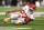 MINNEAPOLIS, MN - OCTOBER 8: Travis Kelce #87 of the Kansas City Chiefs winces in pain after sustaining an injury on a play during the second quarter of an NFL football game against the Minnesota Vikings at U.S. Bank Stadium on October 8, 2023 in Minneapolis, Minnesota. (Photo by Kevin Sabitus/Getty Images)