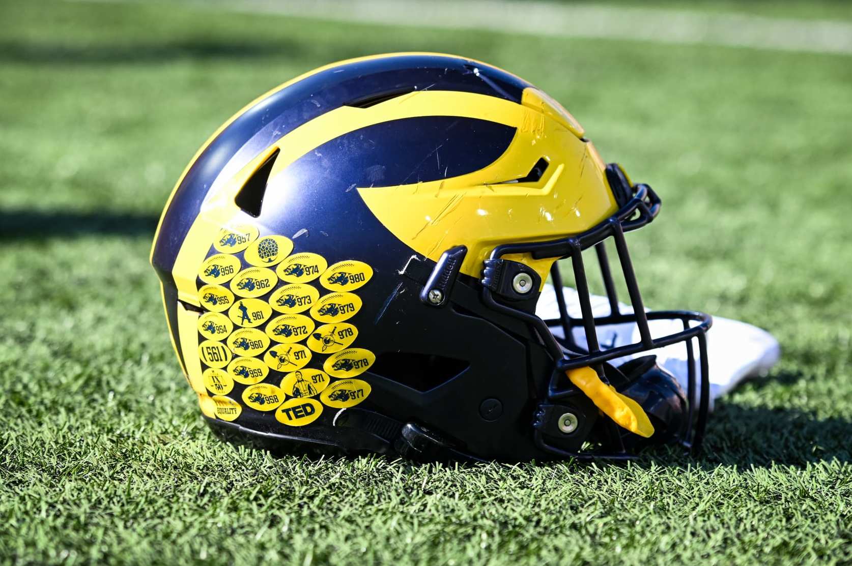 BLOOMINGTON, IN - OCTOBER 08: A Michigan football helmet sits on the field following a college football game between the Michigan Wolverines and Indiana Hoosiers on October 8, 2022 at Memorial Stadium in Bloomington, Indiana. (Photo by James Black/Icon Sportswire via Getty Images) BLOOMINGTON, IN - OCTOBER 08: A Michigan football helmet sits on the field following a college football game between the Michigan Wolverines and Indiana Hoosiers on October 8, 2022 at Memorial Stadium in Bloomington, Indiana. (Photo by James Black/Icon Sportswire via Getty Images)