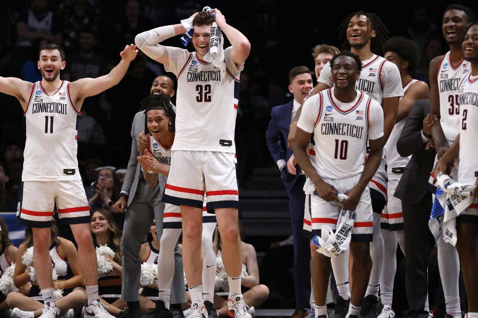 NEW YORK, NEW YORK - MARCH 24: Alex Karaban #11, Donovan Clingan #32, and Hassan Diarra #10 of the Connecticut Huskies react during the second half against the Northwestern Wildcats in the second round of the NCAA Men's Basketball Tournament at Barclays Center on March 24, 2024 in New York City. (Photo by Sarah Stier/Getty Images)