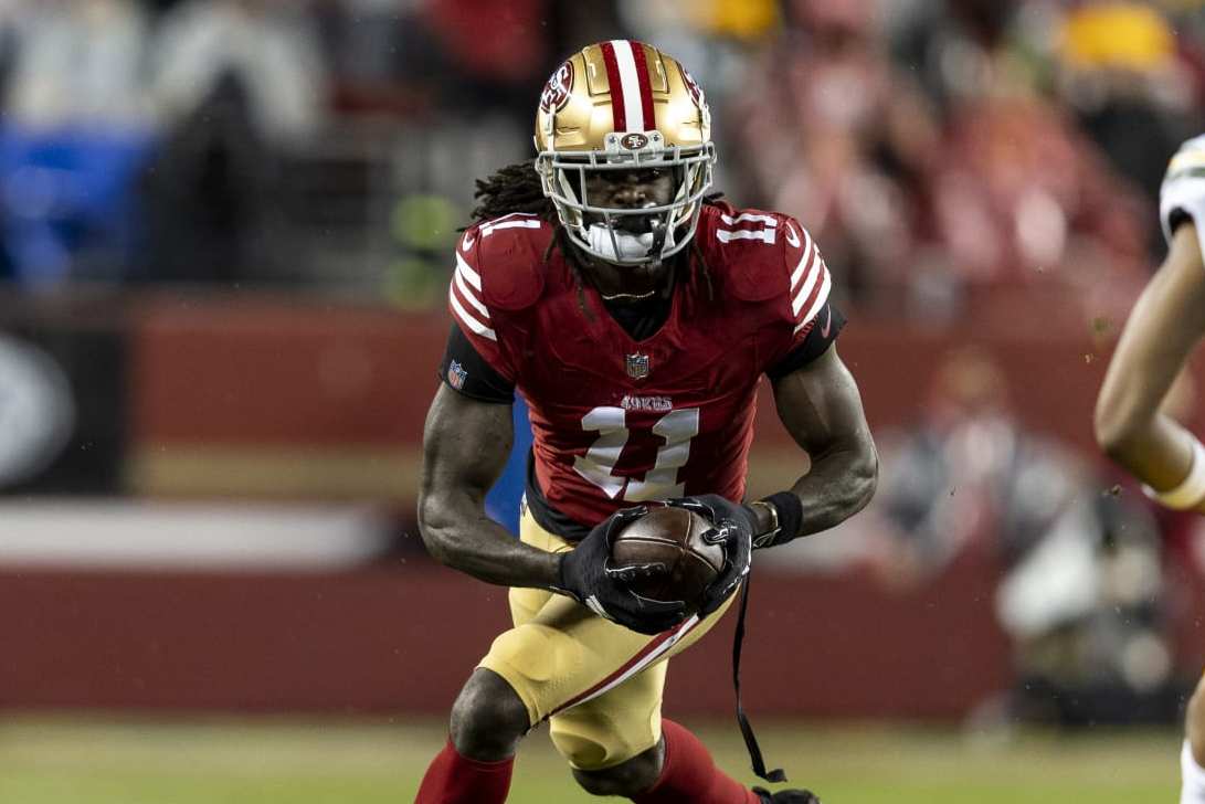 SANTA CLARA, CALIFORNIA - JANUARY 20: Brandon Aiyuk #11 of the San Francisco 49ers runs with the ball during an NFL divisional round playoff football game between the San Francisco 49ers and the Green Bay Packers at Levi's Stadium on January 20, 2024 in Santa Clara, California. (Photo by Michael Owens/Getty Images)