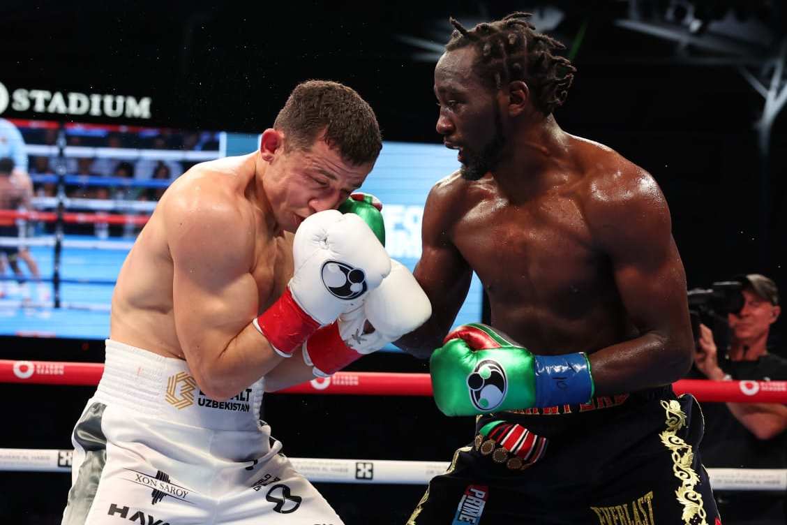 LOS ANGELES, CALIFORNIA - AUGUST 03: Terence Crawford (black and gold shorts) and Israil Madrimov (white shorts) fight during their WBA World Interim WBO World Super Welterweight Title Contest, at BMO Stadium on August 3, 2024 in Los Angeles, California. (Photo by Mark Robinson/Matchroom Boxing/Getty Images)