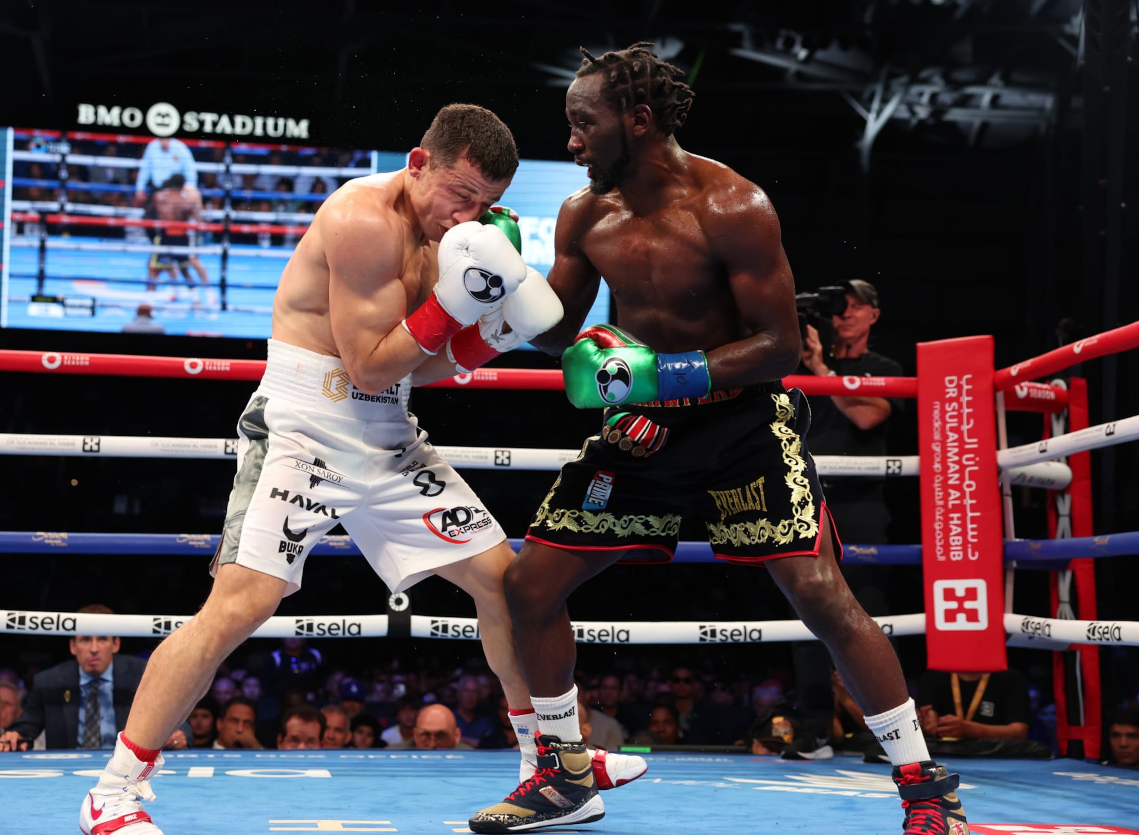 LOS ANGELES, CALIFORNIA - AUGUST 03: Terence Crawford (black and gold shorts) and Israil Madrimov (white shorts) fight during their WBA World Interim WBO World Super Welterweight Title Contest, at BMO Stadium on August 3, 2024 in Los Angeles, California. (Photo by Mark Robinson/Matchroom Boxing/Getty Images)