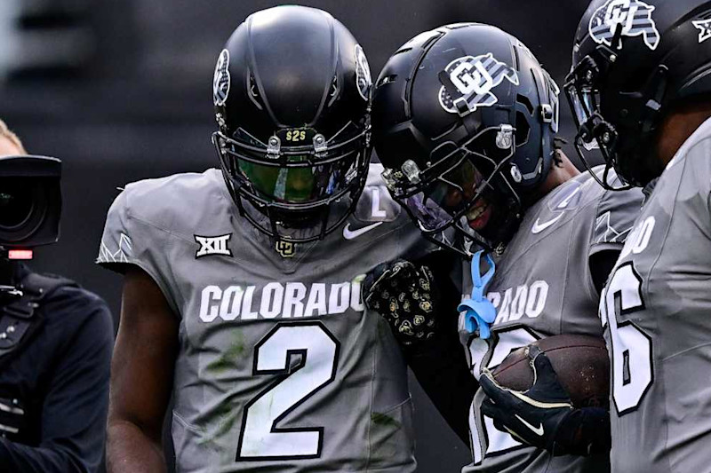 Colorado's Shedeur Sanders (2) and Travis Hunter (12)
