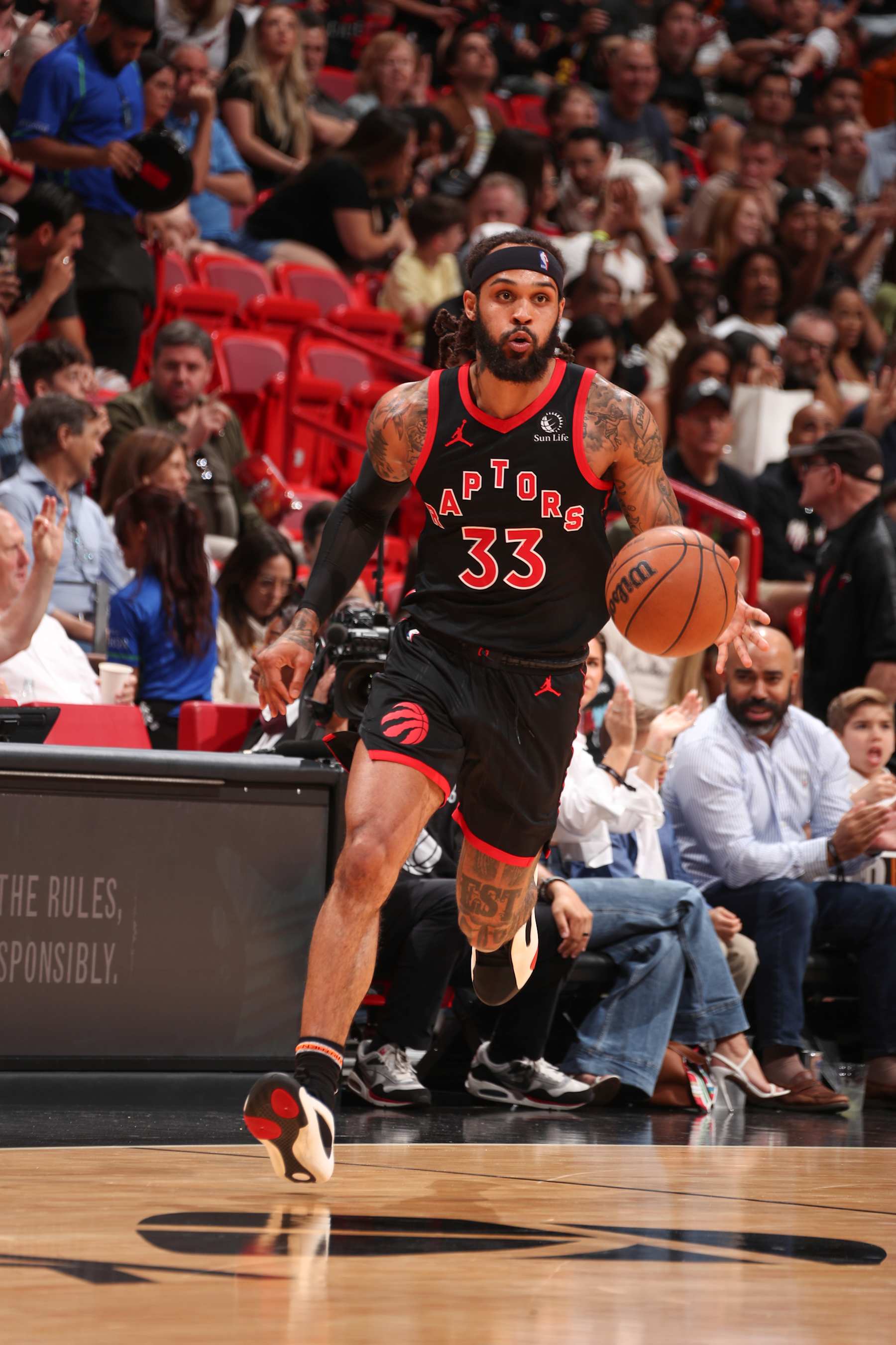 MIAMI, FL - APRIL 14:  Gary Trent Jr. #33 of the Toronto Raptors handles the ball during the game  on April 14, 2024 at Kaseya Center in Miami, Florida. NOTE TO USER: User expressly acknowledges and agrees that, by downloading and or using this Photograph, user is consenting to the terms and conditions of the Getty Images License Agreement. Mandatory Copyright Notice: Copyright 2024 NBAE (Photo by Issac Baldizon/NBAE via Getty Images)