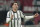Juventus' Dusan Vlahovic controls the ball during the Serie A soccer match between AC Milan and Juventus at the San Siro stadium, in Milan, Italy, Saturday, Oct. 8, 2022. (AP Photo/Antonio Calanni)