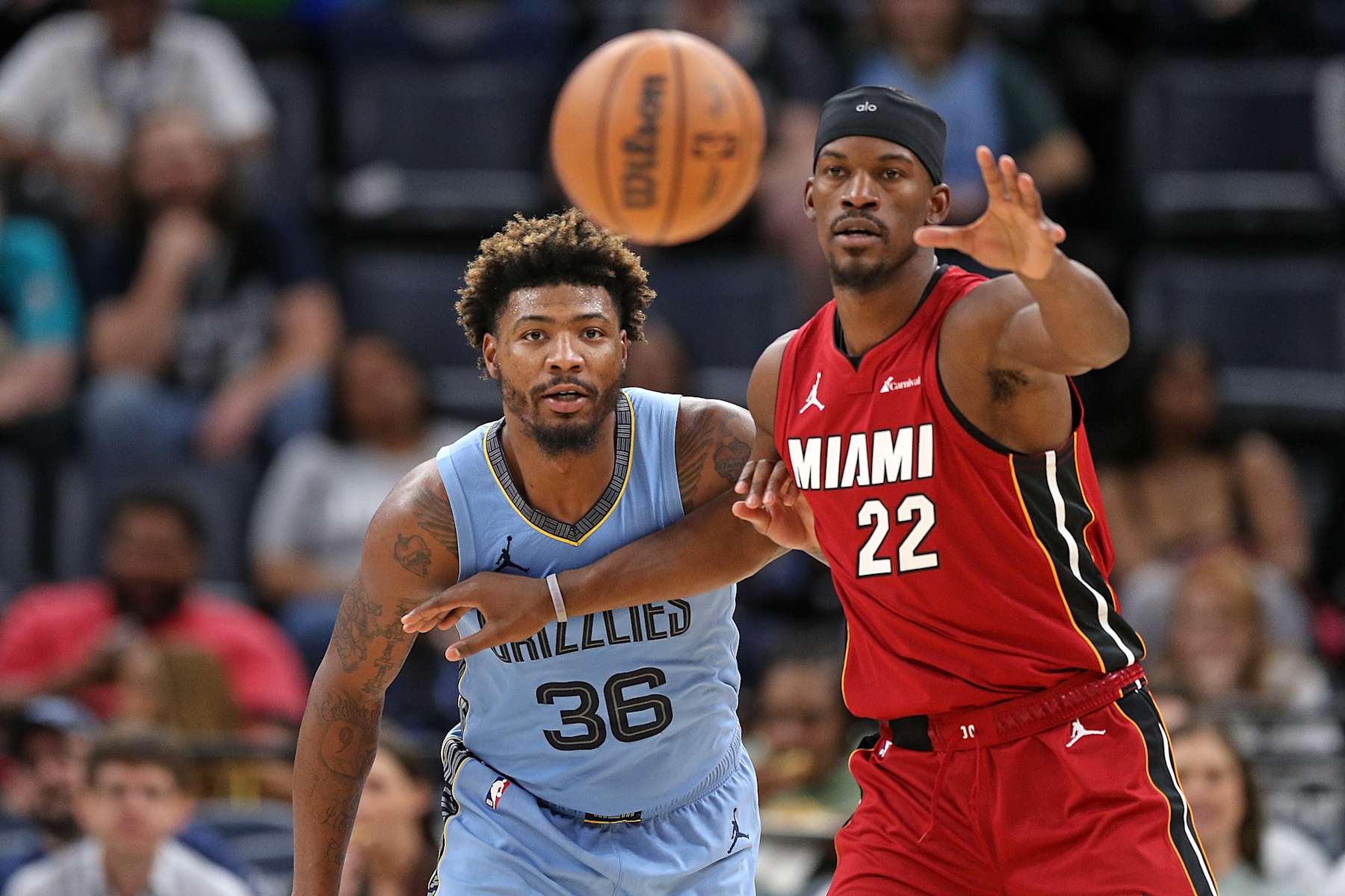MEMPHIS, TENNESSEE - NOVEMBER 08: Jimmy Butler #22 of the Miami Heat and Marcus Smart #36 of the Memphis Grizzlies during the game at FedExForum on November 08, 2023 in Memphis, Tennessee. NOTE TO USER: User expressly acknowledges and agrees that, by downloading and or using this photograph, User is consenting to the terms and conditions of the Getty Images License Agreement. (Photo by Justin Ford/Getty Images)