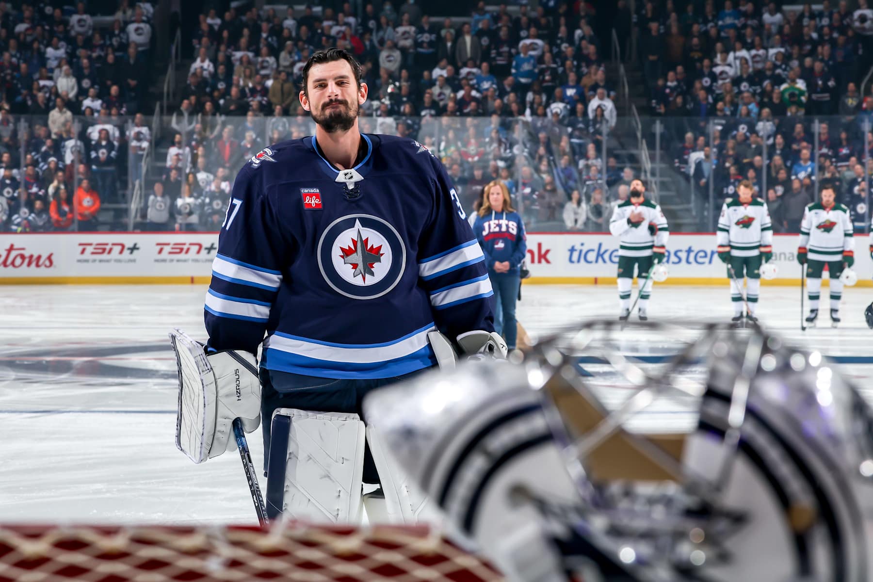 WINNIPEG, CANADA - OCTOBER 13: Goaltender Connor Hellebuyck #37 of the Winnipeg Jets looks on prior to puck drop against the Minnesota Wild at the Canada Life Centre on October 13, 2024 in Winnipeg, Manitoba, Canada. (Photo by Jonathan Kozub/NHLI via Getty Images)