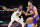 PHOENIX, ARIZONA - OCTOBER 25: Devin Booker #1 of the Phoenix Suns drives the ball against James Wiseman #33 of the Golden State Warriors during the second half of the NBA game at Footprint Center on October 25, 2022 in Phoenix, Arizona. The Suns defeated the Warriors 134-105. NOTE TO USER: User expressly acknowledges and agrees that, by downloading and or using this photograph, User is consenting to the terms and conditions of the Getty Images License Agreement.  (Photo by Christian Petersen/Getty Images)