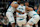 MILWAUKEE, WISCONSIN - NOVEMBER 23: Grant Williams #2 of the Charlotte Hornets helped by his teammates after being injured during the fourth quarter of a game against the Milwaukee Bucks at Fiserv Forum on November 23, 2024 in Milwaukee, Wisconsin. NOTE TO USER: User expressly acknowledges and agrees that, by downloading and or using this photograph, User is consenting to the terms and conditions of the Getty Images License Agreement. (Photo by Patrick McDermott/Getty Images)