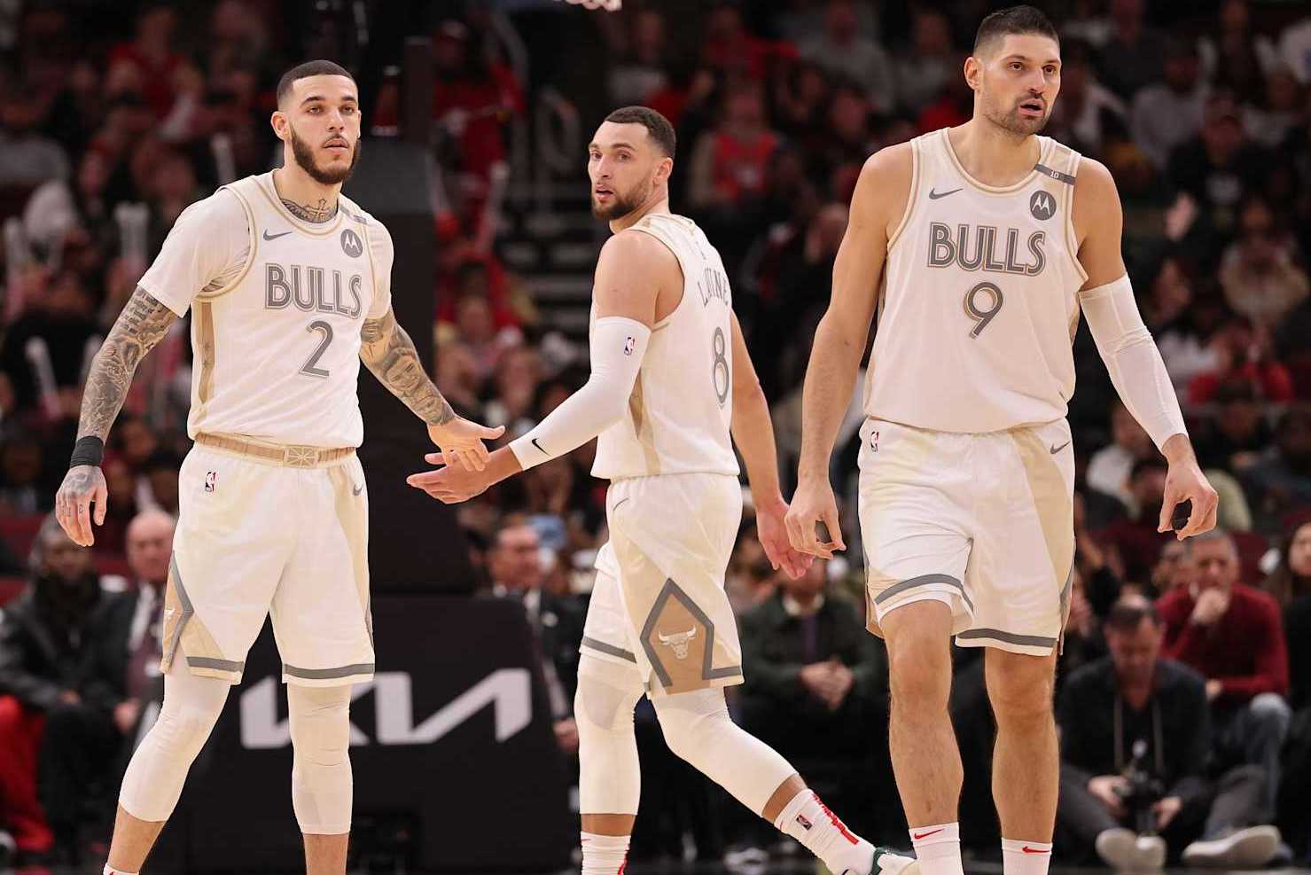 CHICAGO, ILLINOIS - JANUARY 25: Lonzo Ball #2, Zach LaVine #8 and Nikola Vucevic #9 of the Chicago Bulls look on against the Philadelphia 76ers during the second half at the United Center on January 25, 2025 in Chicago, Illinois. NOTE TO USER: User expressly acknowledges and agrees that, by downloading and or using this photograph, User is consenting to the terms and conditions of the Getty Images License Agreement. (Photo by Michael Reaves/Getty Images)