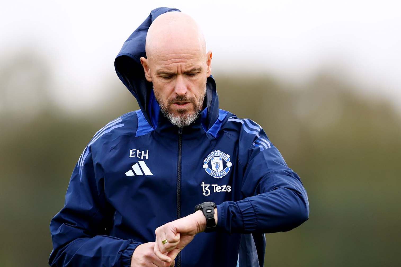 MANCHESTER, ENGLAND - OCTOBER 02: Erik ten Hag, Manager of Manchester United, looks at his watch during the UEFA Europa League 2024/25 League Phase MD2 training and press conference at Carrington Training Ground on October 02, 2024 in Manchester, England. (Photo by Charlotte Tattersall/Getty Images)