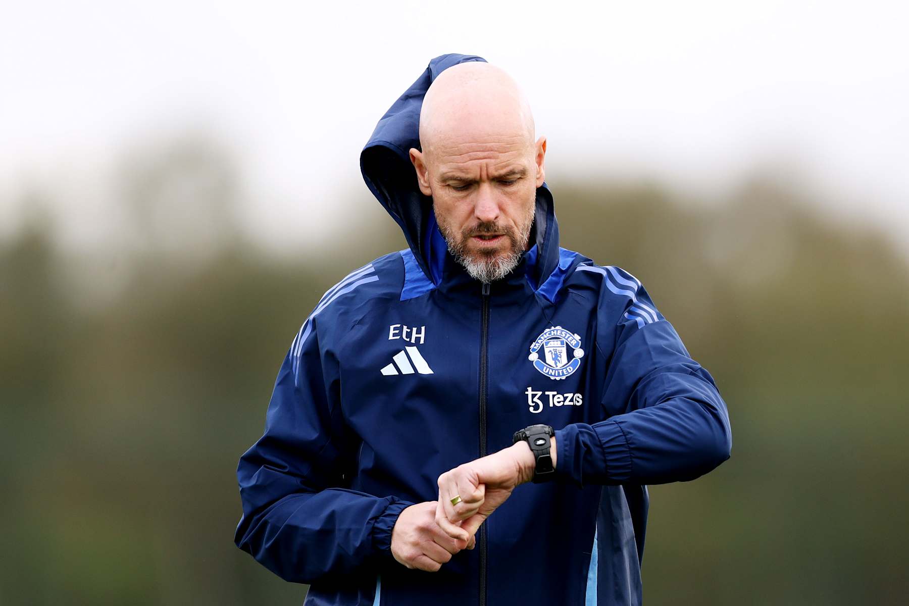 MANCHESTER, ENGLAND - OCTOBER 02: Erik ten Hag, Manager of Manchester United, looks at his watch during the UEFA Europa League 2024/25 League Phase MD2 training and press conference at Carrington Training Ground on October 02, 2024 in Manchester, England. (Photo by Charlotte Tattersall/Getty Images)