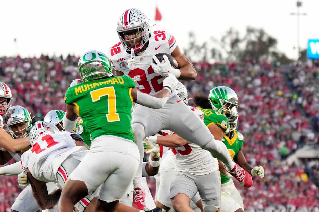 PASADENA, CALIFORNIA - JANUARY 1:TreVeyon Henderson #32 of the Ohio State Buckeyes runs into the end zone for a touchdown against Jabbar Muhammad #7 of the Oregon Ducks during the second half at Rose Bowl Stadium on January 1, 2025 in Pasadena, California. (Photo by CFP/Getty Images)