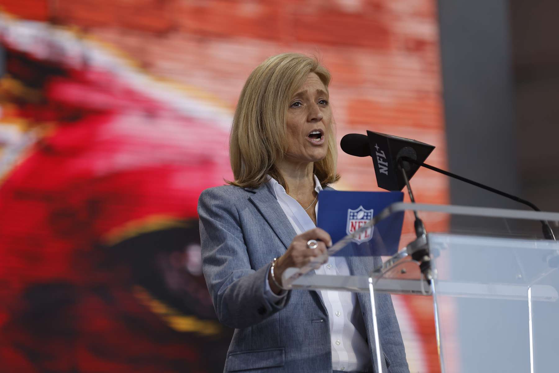 KANSAS CITY, MO - APRIL 29: Dawn Aponte, Chief Football Administrative Officer with the NFL, announces a fourth round draft pick selection during the 2023 NFL Draft at Union Station on April 29, 2023 in Kansas City, Missouri. (Photo by David Eulitt/Getty Images)