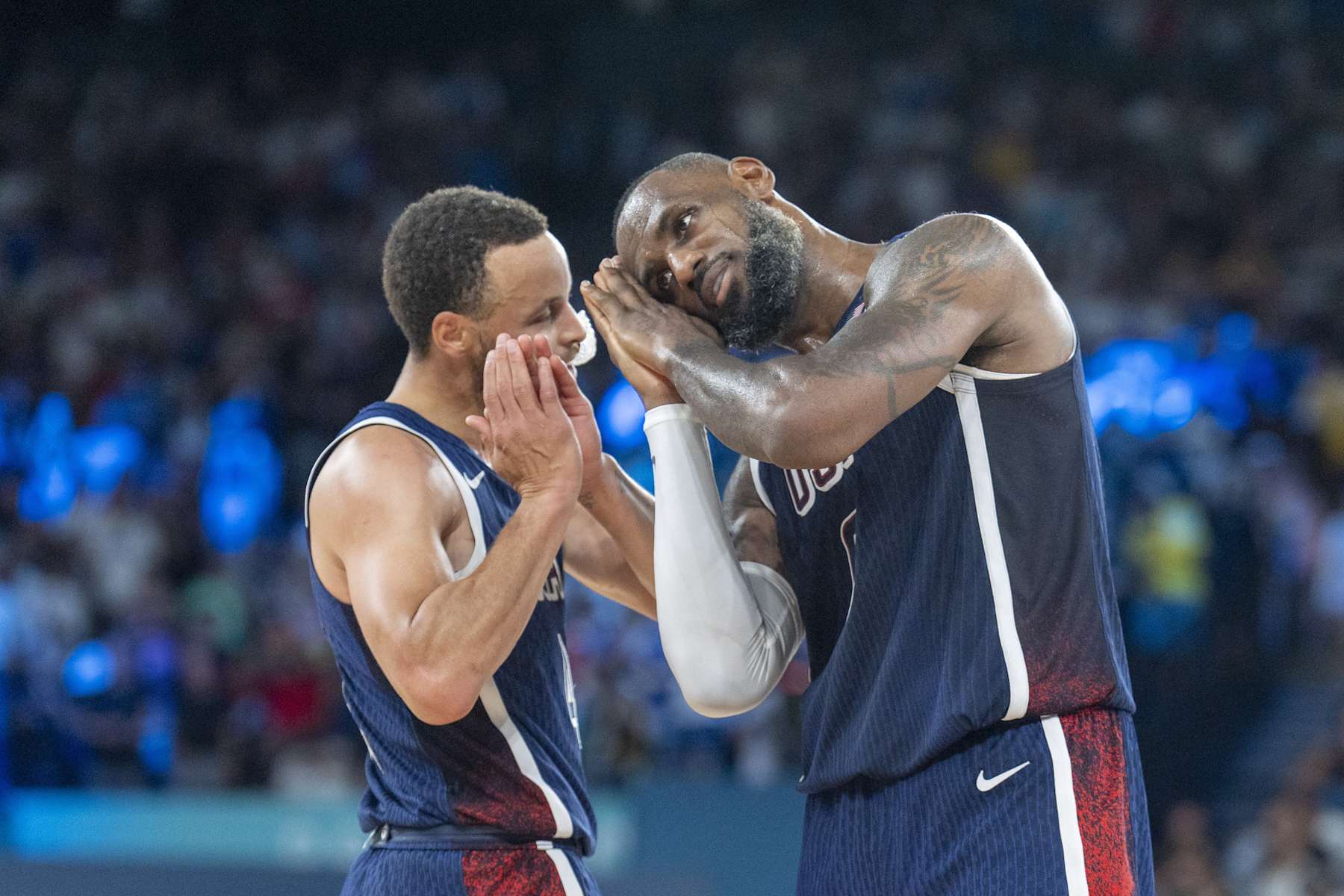 PARIS, FRANCE - AUGUST 10: Stephen Curry (4) and LeBron James of Team USA celebrate during Men's Gold Medal game between Team France and Team United States on day fifteen of the Olympic Games Paris 2024 at Bercy Arena on August 10, 2024 in Paris, France. (Photo by Aytac Unal/Anadolu via Getty Images)