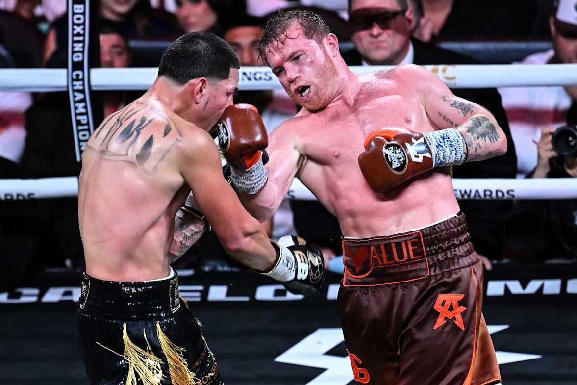 LAS VEGAS, NEVADA - SEPTEMBER 14: Saul 'Canelo' Alvarez (in brown short) from Guadalajara, Mexico and Edgar Berlanga (in black&gold short) from Brooklyn, New York exchange punches during their super middleweight world titles of the Premiere Boxing Championship on Saturday night at the T-Mobile Arena in Las Vegas, Nevada, United States on September 14, 2024. (Photo by Tayfun Coskun/Anadolu via Getty Images)