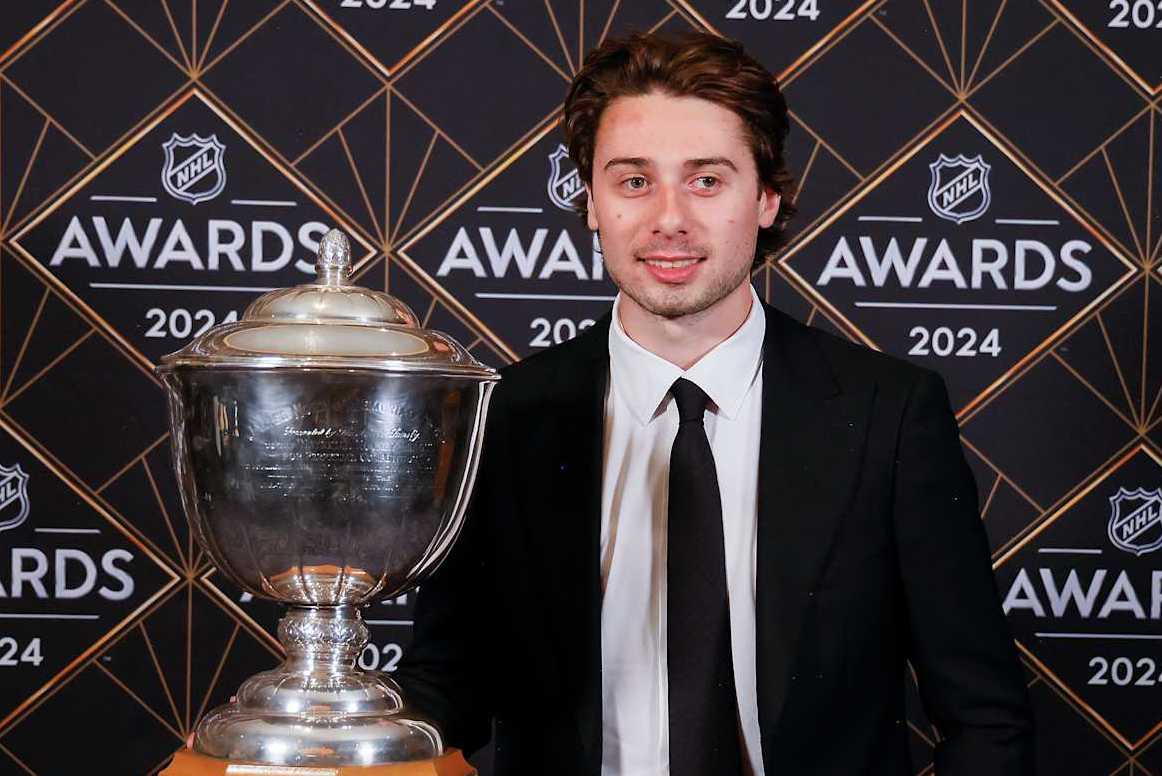 LAS VEGAS, NEVADA - JUNE 27: Quinn Hughes of the Vancouver Canucks poses with the James Norris Memorial Trophy during the 2024 NHL Awards at BleauLive Theater at Fontainebleau Las Vegas on June 27, 2024 in Las Vegas, Nevada. (Photo by Bruce Bennett/Getty Images)