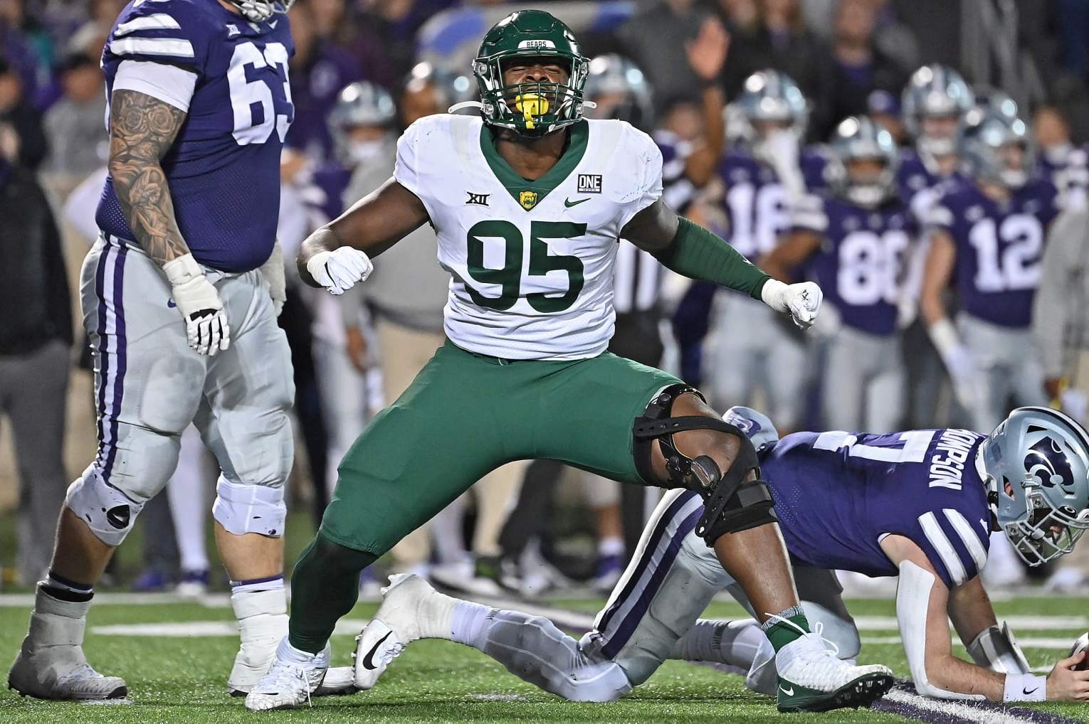 MANHATTAN, KS - NOVEMBER 20: Defensive lineman Gabe Hall #95 of the Baylor Bears celebrates after sacking quarterback Skylar Thompson #7 of the Kansas State Wildcats, during the second half at Bill Snyder Family Football Stadium on November 20, 2021 in Manhattan, Kansas. (Photo by Peter Aiken/Getty Images)