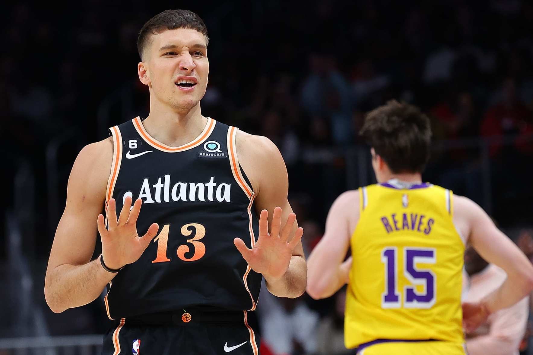 ATLANTA, GEORGIA - DECEMBER 30: Bogdan Bogdanovic #13 of the Atlanta Hawks reacts after a three-point basket against the Los Angeles Lakers during the first quarter at State Farm Arena on December 30, 2022 in Atlanta, Georgia. NOTE TO USER: User expressly acknowledges and agrees that, by downloading and or using this photograph, User is consenting to the terms and conditions of the Getty Images License Agreement. (Photo by Kevin C. Cox/Getty Images)
