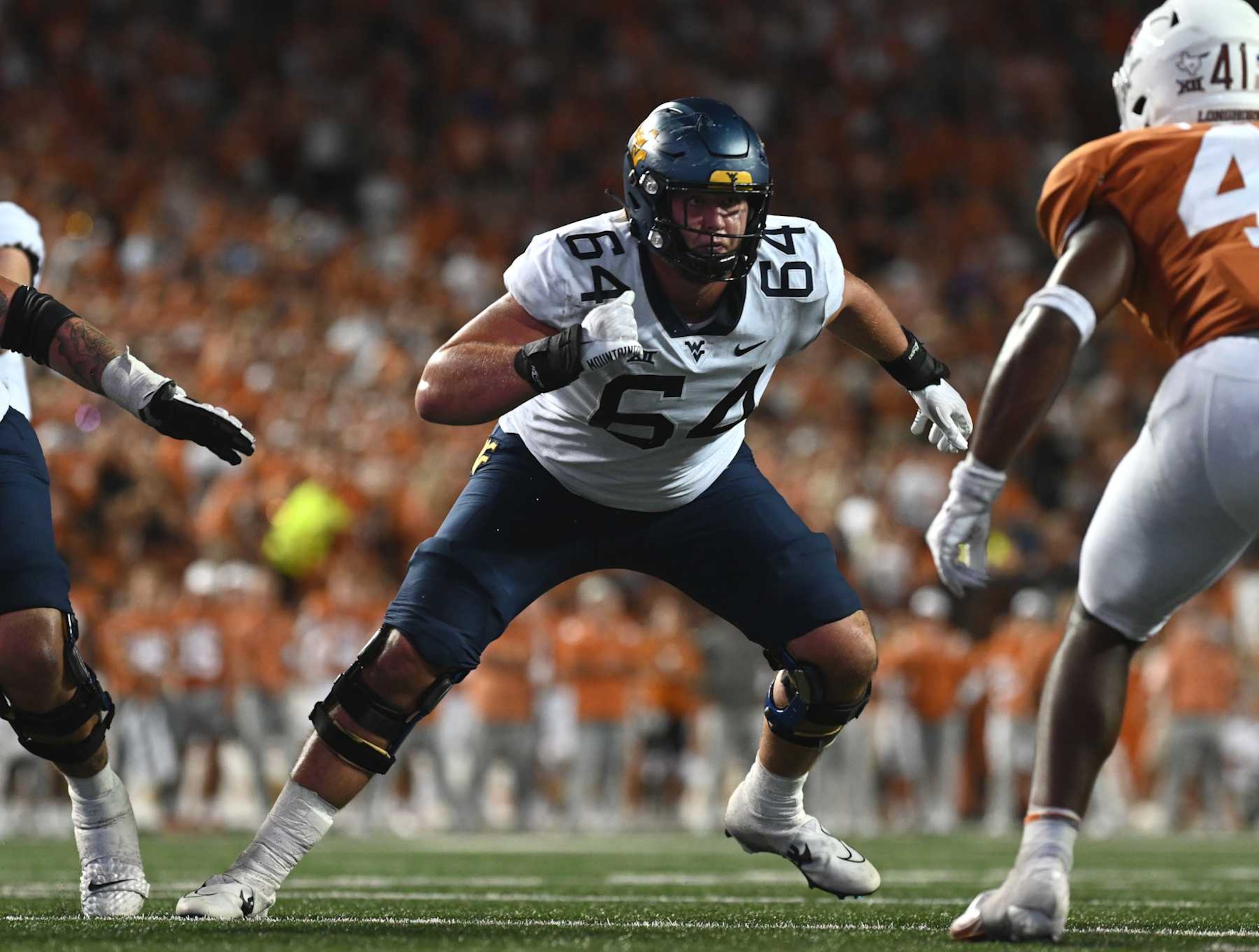 AUSTIN, TX - OCTOBER 01: West Virginia Mountaineer lineman Wyatt Milum blocks during the game between the West Virginia Mountaineers and the Texas Longhorns on October 1, 2022, at Darrell K Royal-Texas Memorial Stadium in Austin, Texas. (Photo by John Rivera/Icon Sportswire via Getty Images) AUSTIN, TX - OCTOBER 01: West Virginia Mountaineer lineman Wyatt Milum blocks during the game between the West Virginia Mountaineers and the Texas Longhorns on October 1, 2022, at Darrell K Royal-Texas Memorial Stadium in Austin, Texas. (Photo by John Rivera/Icon Sportswire via Getty Images)