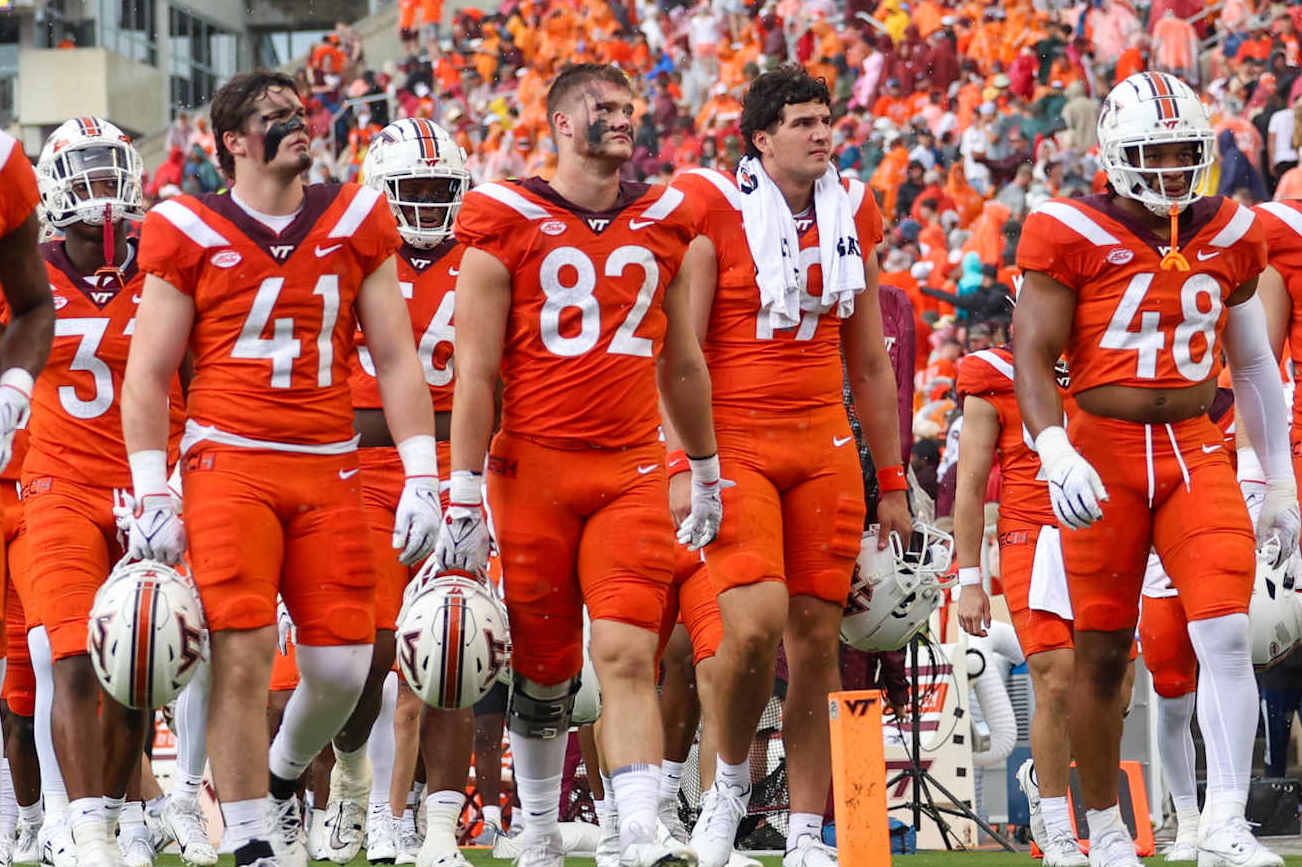 BLACKSBURG, VIRGINIA - SEPTEMBER 9: Members of the Virginia Tech Hokies football team walk off the field following a weather delay in the first quarter of a game against the Purdue Boilermakers at Lane Stadium on September 9, 2023 in Blacksburg, Virginia. (Photo by Ryan Hunt/Getty Images)