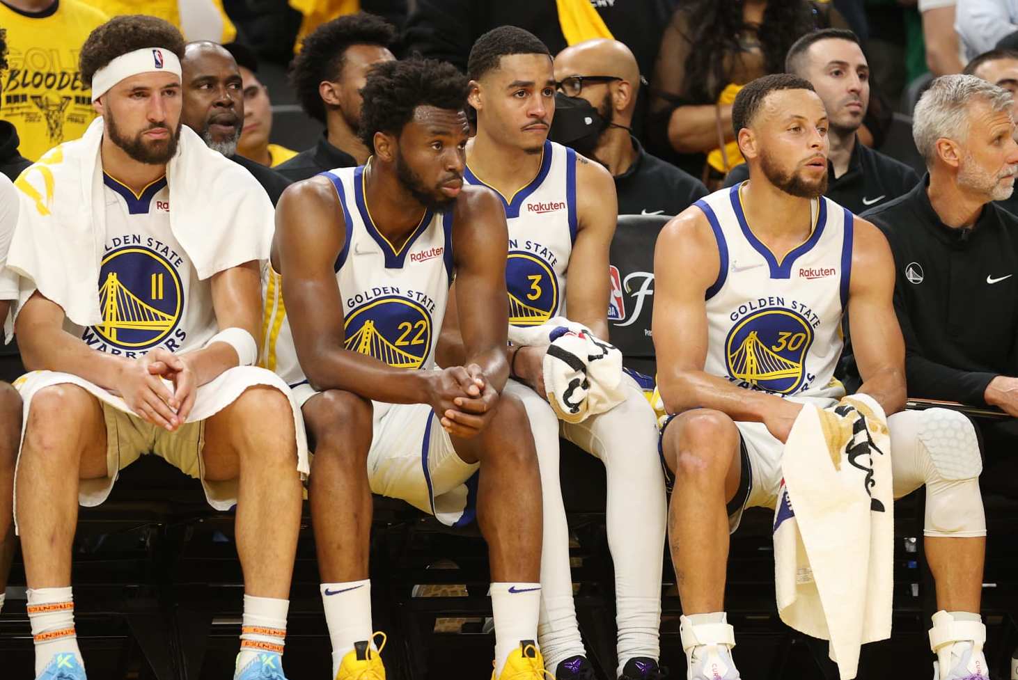 SAN FRANCISCO, CALIFORNIA - JUNE 02: (L to R) Kevon Looney #5, Klay Thompson #11, Andrew Wiggins #22, Jordan Poole #3, and Stephen Curry #30 of the Golden State Warriors look on from the bench during the fourth quarter against the Boston Celtics in Game One of the 2022 NBA Finals at Chase Center on June 02, 2022 in San Francisco, California. NOTE TO USER: User expressly acknowledges and agrees that, by downloading and/or using this photograph, User is consenting to the terms and conditions of the Getty Images License Agreement. (Photo by Ezra Shaw/Getty Images) SAN FRANCISCO, CALIFORNIA - JUNE 02: (L to R) Kevon Looney #5, Klay Thompson #11, Andrew Wiggins #22, Jordan Poole #3, and Stephen Curry #30 of the Golden State Warriors look on from the bench during the fourth quarter against the Boston Celtics in Game One of the 2022 NBA Finals at Chase Center on June 02, 2022 in San Francisco, California. NOTE TO USER: User expressly acknowledges and agrees that, by downloading and/or using this photograph, User is consenting to the terms and conditions of the Getty Images License Agreement. (Photo by Ezra Shaw/Getty Images)