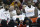 Cleveland Cavaliers' Tristan Thompson, left to right, Kyrie Irving and LeBron James watch from the bench in the second half of an NBA basketball game against the Philadelphia 76ers, Friday, March 31, 2017, in Cleveland. (AP Photo/Tony Dejak)