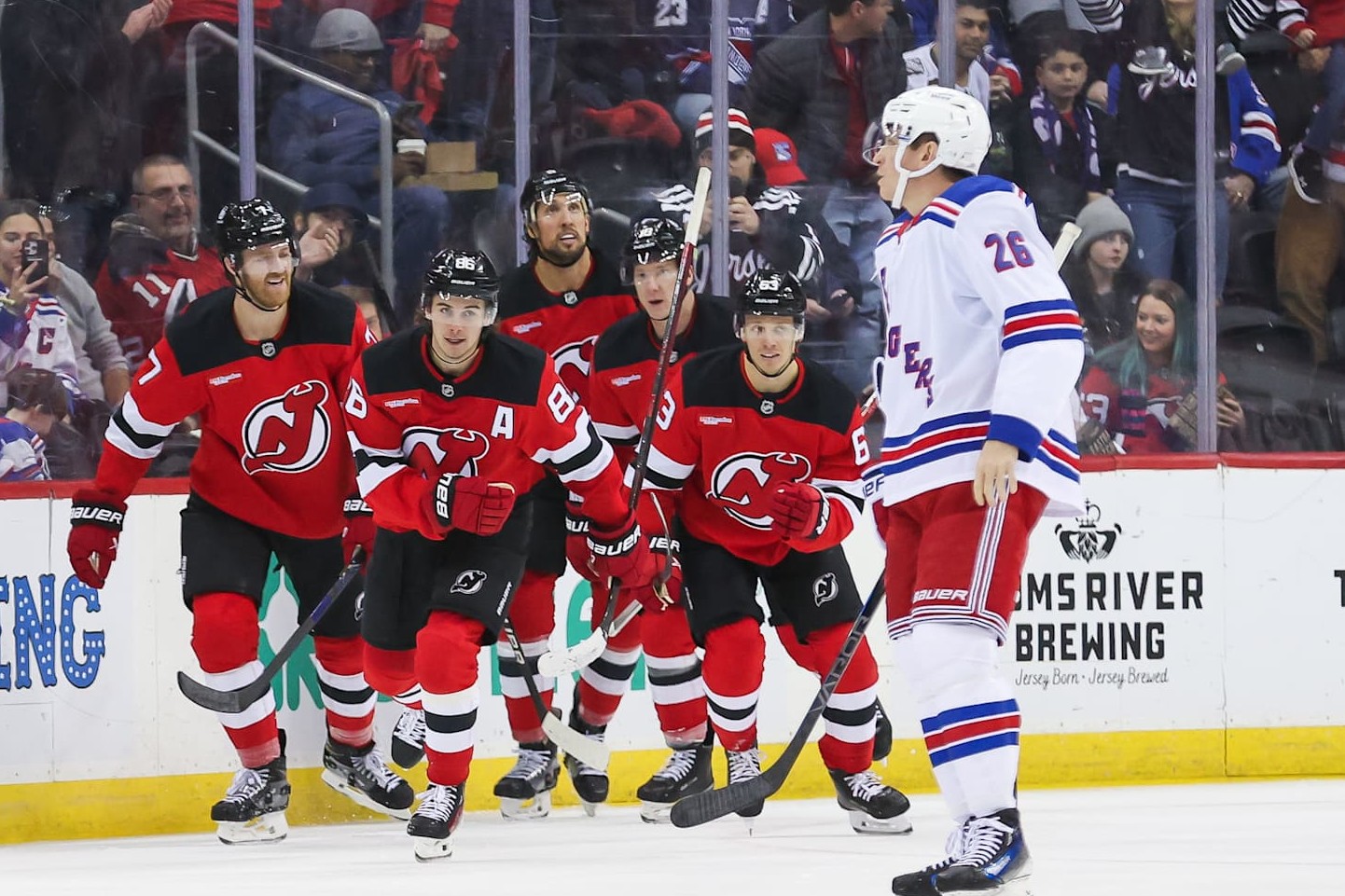 NEWARK, NJ - DECEMBER 23: New Jersey Devils center Jack Hughes (86) celebrates after scoring a goal during a NHL game between the New York Rangers and New Jersey Devils at Prudential Center on December 23, 2024 in Newark, New Jersey. (Photo by Andrew Mordzynski/Icon Sportswire via Getty Images)