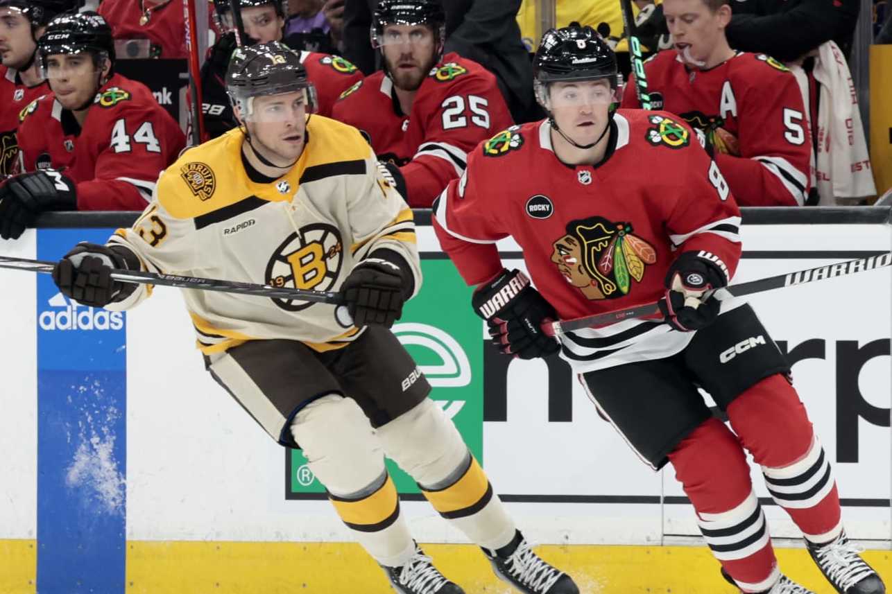 BOSTON, MA - OCTOBER 11: Boston Bruins center Charlie Coyle (13) sticks to Chicago Blackhawks winger Ryan Donato (8) during a game between the Boston Bruins and the Chicago Blackhawks on October 11, 2023, at TD Garden in Boston, Massachusetts. (Photo by Fred Kfoury III/Icon Sportswire via Getty Images)