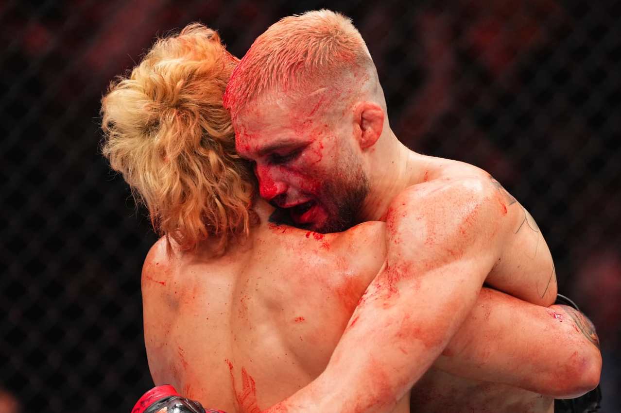 TORONTO, ONTARIO - JANUARY 20: (L-R) Ramon Taveras and Serhiy Sidey of Ukraine hug after their bantamweight bout during the UFC 297 event at Scotiabank Arena on January 20, 2024 in Toronto, Ontario. (Photo by Jeff Bottari/Zuffa LLC via Getty Images)