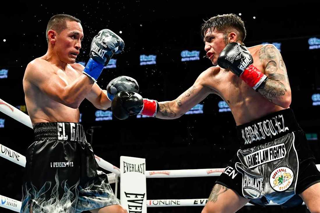 PHOENIX, ARIZONA - JUNE 29: Juan Francisco Estrada (L) of Mexico and Jesse ‘Bam’ Rodriguez (R) of the United States fight during their WBC world and Ring Magazine super flyweight title bout at Footprint Center on June 29, 2024 in Phoenix, Arizona. (Photo by Kelsey Grant/Getty Images)