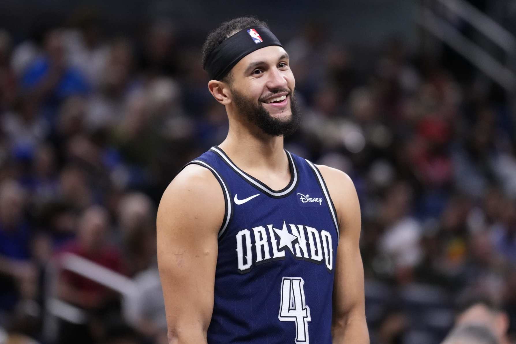 ORLANDO, FLORIDA - APRIL 07: Jalen Suggs #4 of the Orlando Magic looks on against the Chicago Bulls during the third quarter at Kia Center on April 07, 2024 in Orlando, Florida. NOTE TO USER: User expressly acknowledges and agrees that, by downloading and or using this photograph, User is consenting to the terms and conditions of the Getty Images License Agreement. (Photo by Rich Storry/Getty Images)
