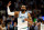 MINNEAPOLIS, MINNESOTA - DECEMBER 30: Mike Conley #10 of the Minnesota Timberwolves celebrates his three-point basket against the Los Angeles Lakers in the fourth quarter at Target Center on December 30, 2023 in Minneapolis, Minnesota. The Timberwolves defeated the Lakers 108-106. NOTE TO USER: User expressly acknowledges and agrees that, by downloading and or using this photograph, User is consenting to the terms and conditions of the Getty Images License Agreement. (Photo by David Berding/Getty Images)