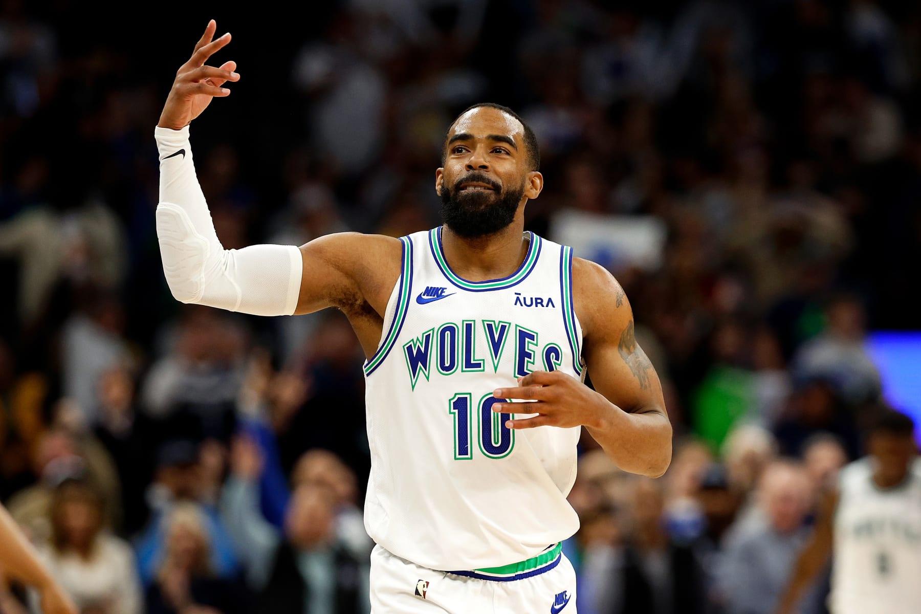 MINNEAPOLIS, MINNESOTA - DECEMBER 30: Mike Conley #10 of the Minnesota Timberwolves celebrates his three-point basket against the Los Angeles Lakers in the fourth quarter at Target Center on December 30, 2023 in Minneapolis, Minnesota. The Timberwolves defeated the Lakers 108-106. NOTE TO USER: User expressly acknowledges and agrees that, by downloading and or using this photograph, User is consenting to the terms and conditions of the Getty Images License Agreement. (Photo by David Berding/Getty Images)