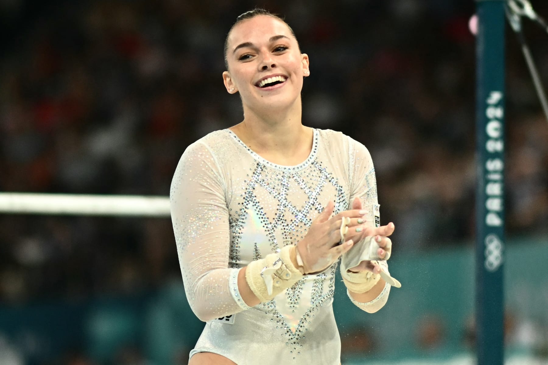 Italy's Giorgia Villa competes in the uneven bars event of the artistic gymnastics women's team final during the Paris 2024 Olympic Games at the Bercy Arena in Paris, on July 30, 2024. (Photo by Loic VENANCE / AFP) (Photo by LOIC VENANCE/AFP via Getty Images)