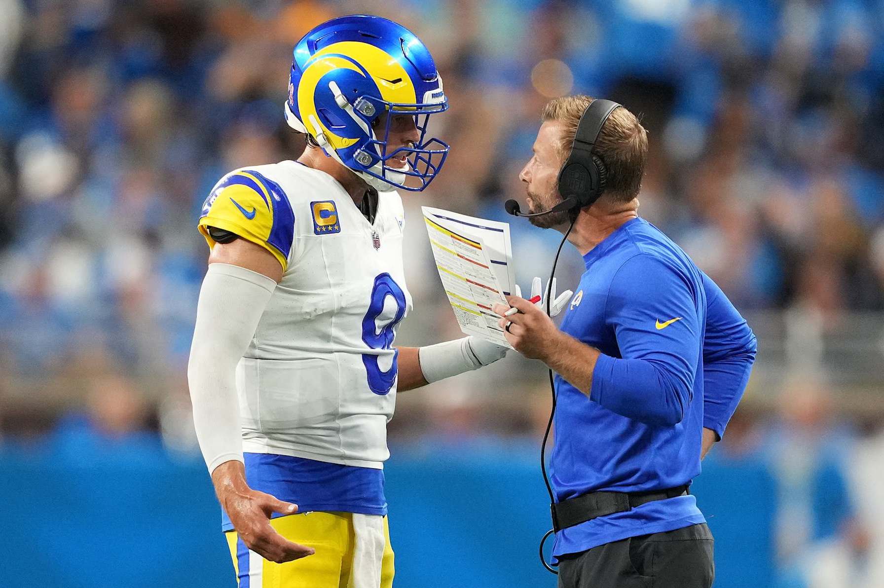 DETROIT, MICHIGAN - SEPTEMBER 08: Head coach Sean McVay of the Los Angeles Rams speaks with Matthew Stafford #9 during their game against the Detroit Lions at Ford Field on September 08, 2024 in Detroit, Michigan. (Photo by Nic Antaya/Getty Images)